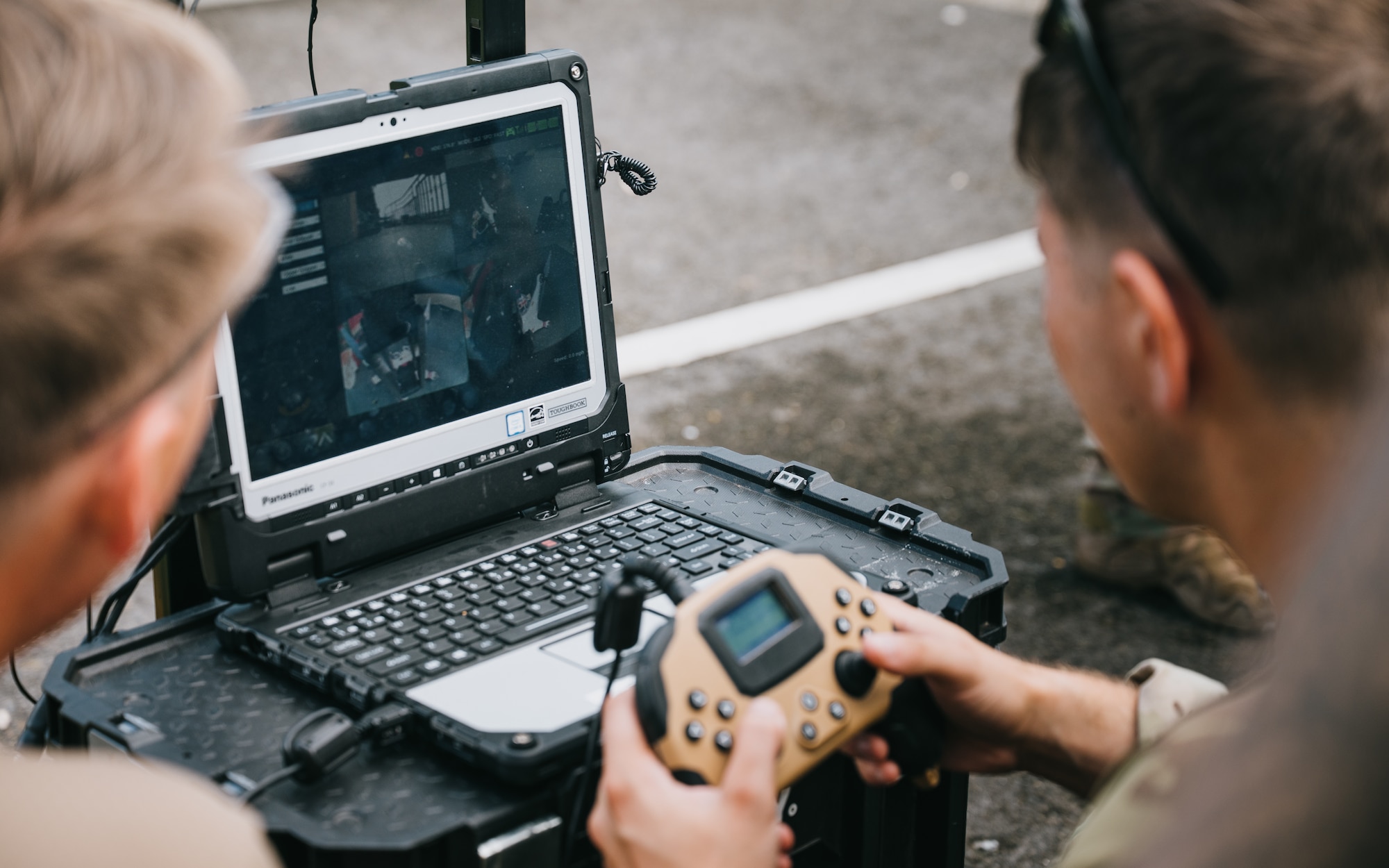 airmen use power tools