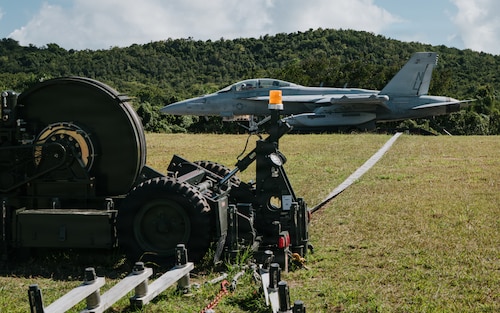airmen use power tools