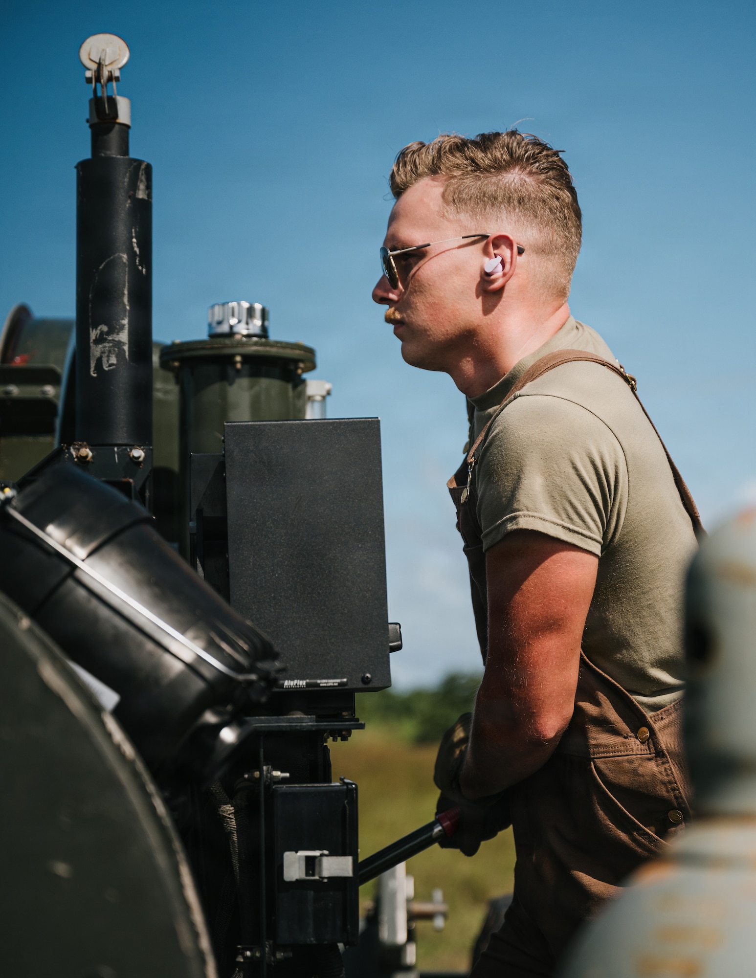 airmen use power tools