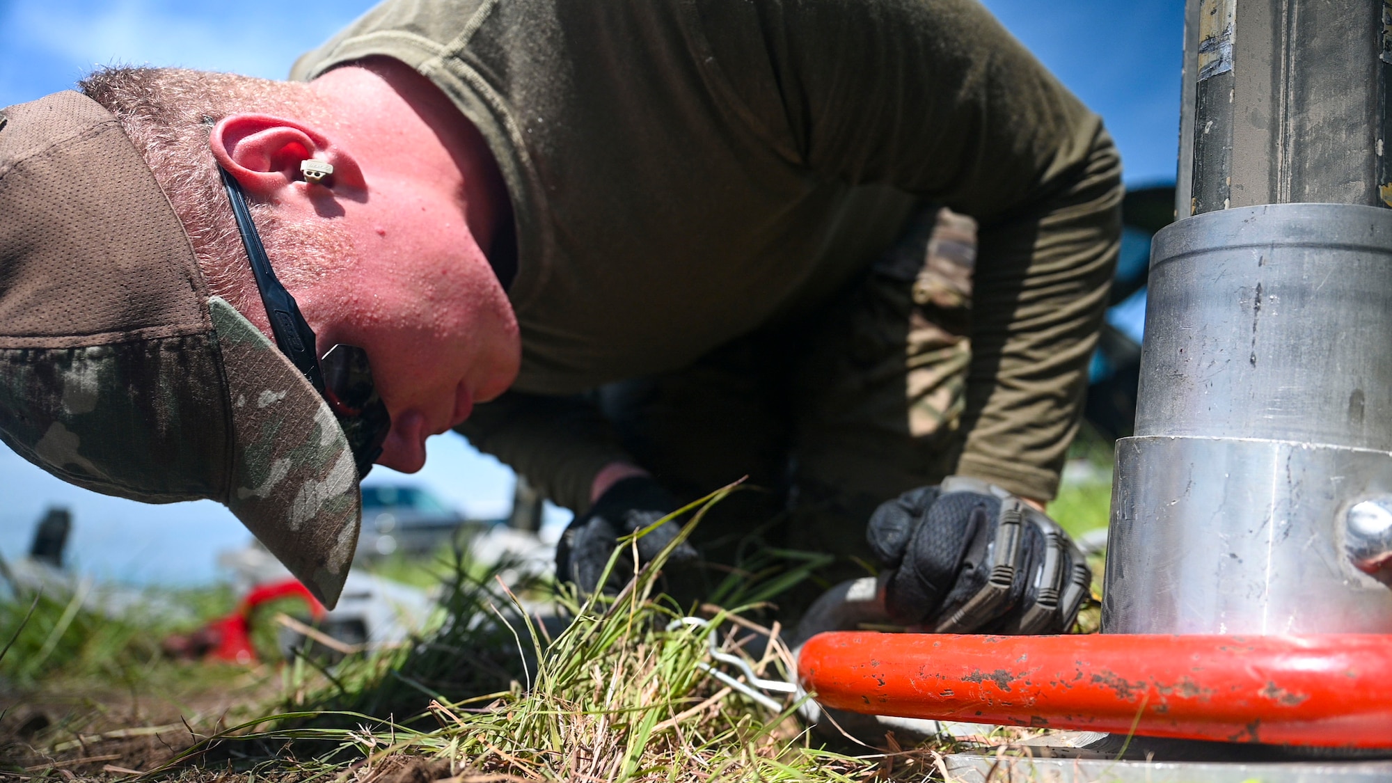 airmen use power tools