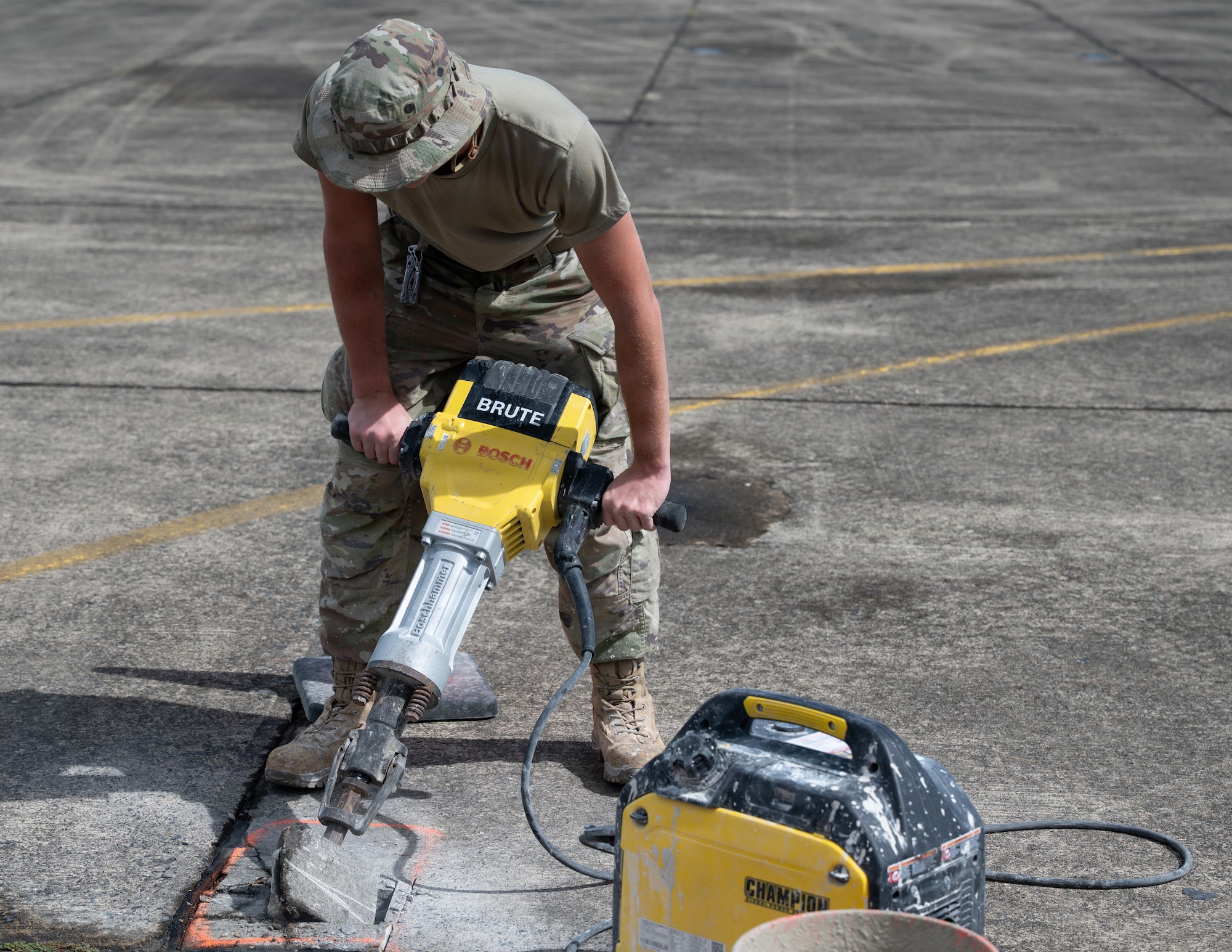airmen use power tools