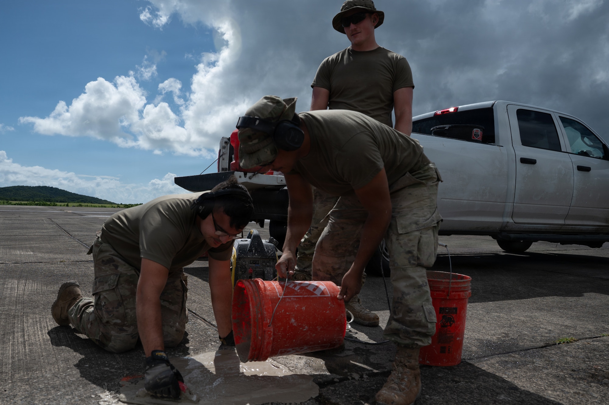 airmen use power tools