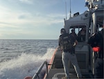 Special agents with the U.S. Coast Guard Investigative Service, supported by Coast Guard surface and aviation assets, conduct an offshore interdiction operation involving the sailing vessel Soulmate approximately 40 nautical miles off the coast of Melbourne, Florida. The operation is part of an ongoing criminal investigation into the disappearance of Lynette Hooker. (U.S. Coast Guard photo)