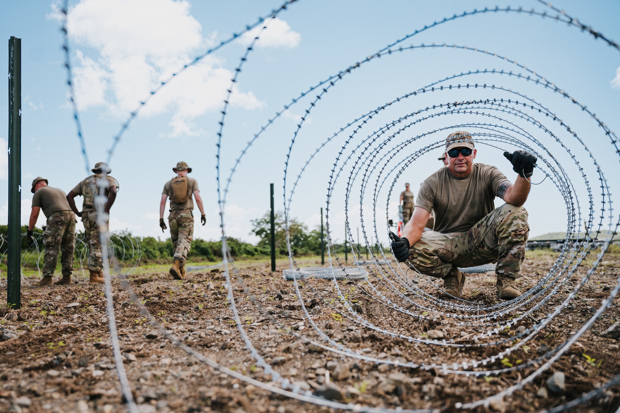 airmen use power tools