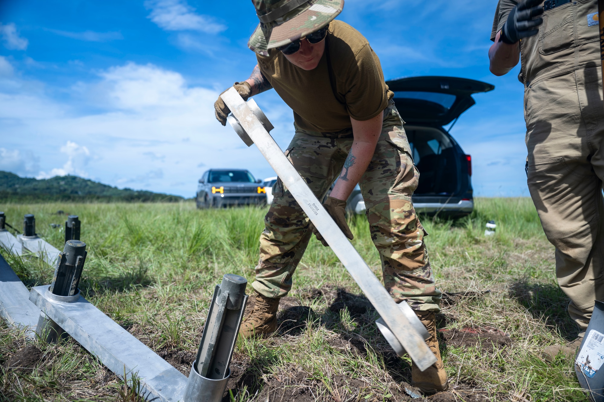 airmen use power tools