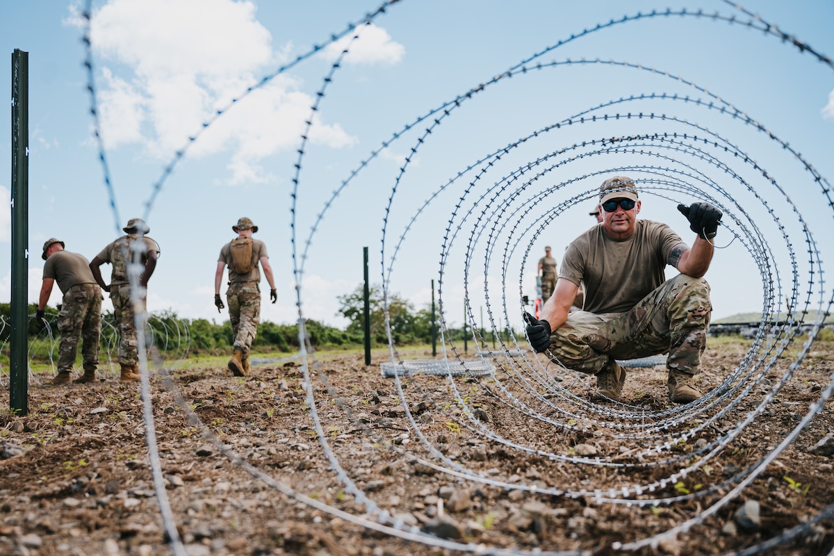 airmen use power tools