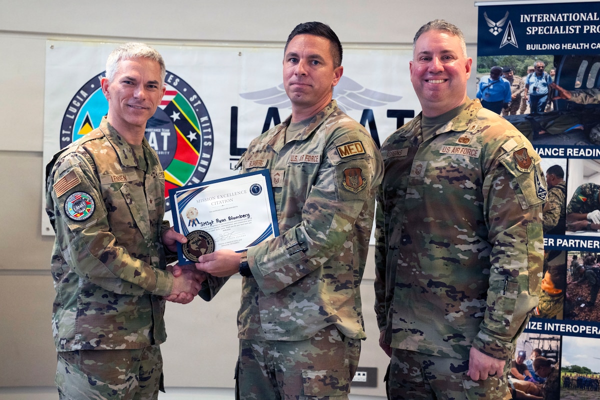 Image of Airmen posing for a photo.