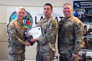 Image of Airmen posing for a photo.