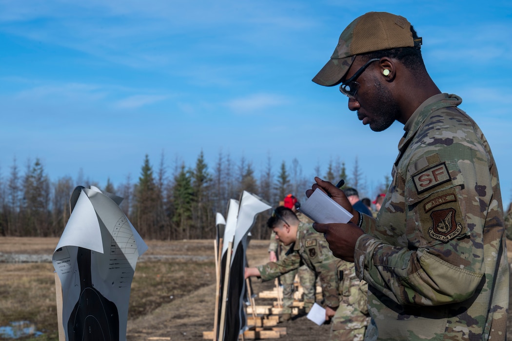 U.S. Air Force Airman 1st Class Jaylen Lee, 354th Security Forces Squadron installation entry controller, writes down his scores during the Excellence in Competition event at Eielson Air Force Base, Alaska, May 13, 2026.