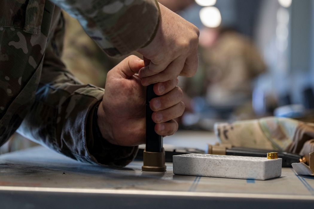 U.S. Air Force Master Sgt. Daniel Franklin, 354th Civil Engineer Squadron facilities superintendent, loads a magazine with bullets during the Excellence in Competition at Eielson Air Force Base, Alaska, May 13, 2026.