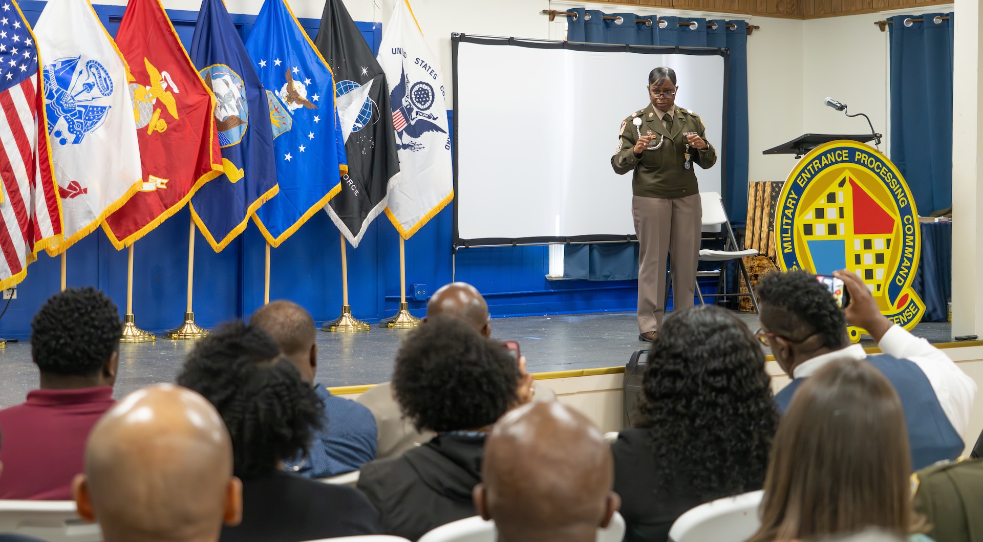 USMEPCOM outgoing Command Sgt. Maj. Yveline Symonette, retired, delivers remarks during a change of responsibility and retirement ceremony May 15. Army Command Sgt. Maj. Gary Krese accepted responsibility as the new senior enlisted advisor of USMEPCOM HQ, succeeding Army Command Sgt. Maj. Yveline Symonette.