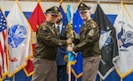 USMEPCOM Commander passes the unit guidon to Army Command Sgt. Maj. Gary Krese during a change of responsibility and retirement ceremony May 15. Krese accepted responsibility as the new senior enlisted advisor of USMEPCOM HQ, succeeding Army Command Sgt. Maj. Yveline Symonette.