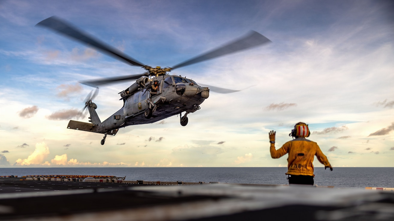 A U.S. Navy MH-60S Sea Hawk, assigned Helicopter Sea Combat Squadron (HSC) 21, hovers in preparation for fast-rope training aboard Wasp-class amphibious assault ship USS Boxer (LHD 4) in the Indian Ocean, May 4, 2026. The 11th Marine Expeditionary Unit, embarked aboard the Boxer Amphibious Ready Group, is a persistent, combat credible force contributing to deterrence and crisis response in the U.S. 7th Fleet area of operations. U.S. 7th Fleet, the U.S. Navy's largest forward-deployed numbered fleet, routinely interacts and operates with allies and partners to preserve a free and open Indo-Pacific. (U.S. Marine Corps photo by Sgt. Trent A. Henry)