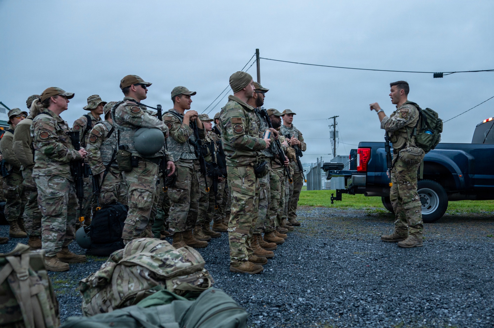Photo of Airmen being briefed