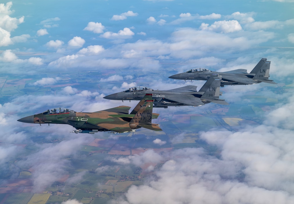 U.S. Air Force F-15E Strike Eagles assigned to the 494th Fighter Squadron fly in formation over the United Kingdom, May 7, 2026. Members of the 48th Equipment Maintenance Squadron painted the aircraft in a camouflage pattern to honor the legacy of Operation El Dorado Canyon and pay tribute to Capt. Fernando Ribas-Dominicci and Paul Lorence, who were lost during the mission in 1986. Their call sign, “KARMA 52”, was painted on the aircraft in tribute. (U.S. Air Force photo by Maj. Dorian Javidi)