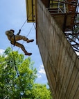 A Soldier competing in the Region V Best Warrior Competition rappels from a training tower at Camp Beauregard in Pineville, Louisiana, May 4, 2026.