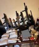 Illicit drugs and weapons sit on display after seizure by the Georgia Bureau of Investigation and the Butts County Sheriff’s Office in March 2026. The Georgia National Guard Counterdrug Task Force, which supports state, local and federal law enforcement agencies in the detection, interdiction and disruption of drug trafficking and transnational criminal organizations, played a crucial behind the scenes role in the investigation. Portions of this photo have been altered for security purposes. Courtesy photo.