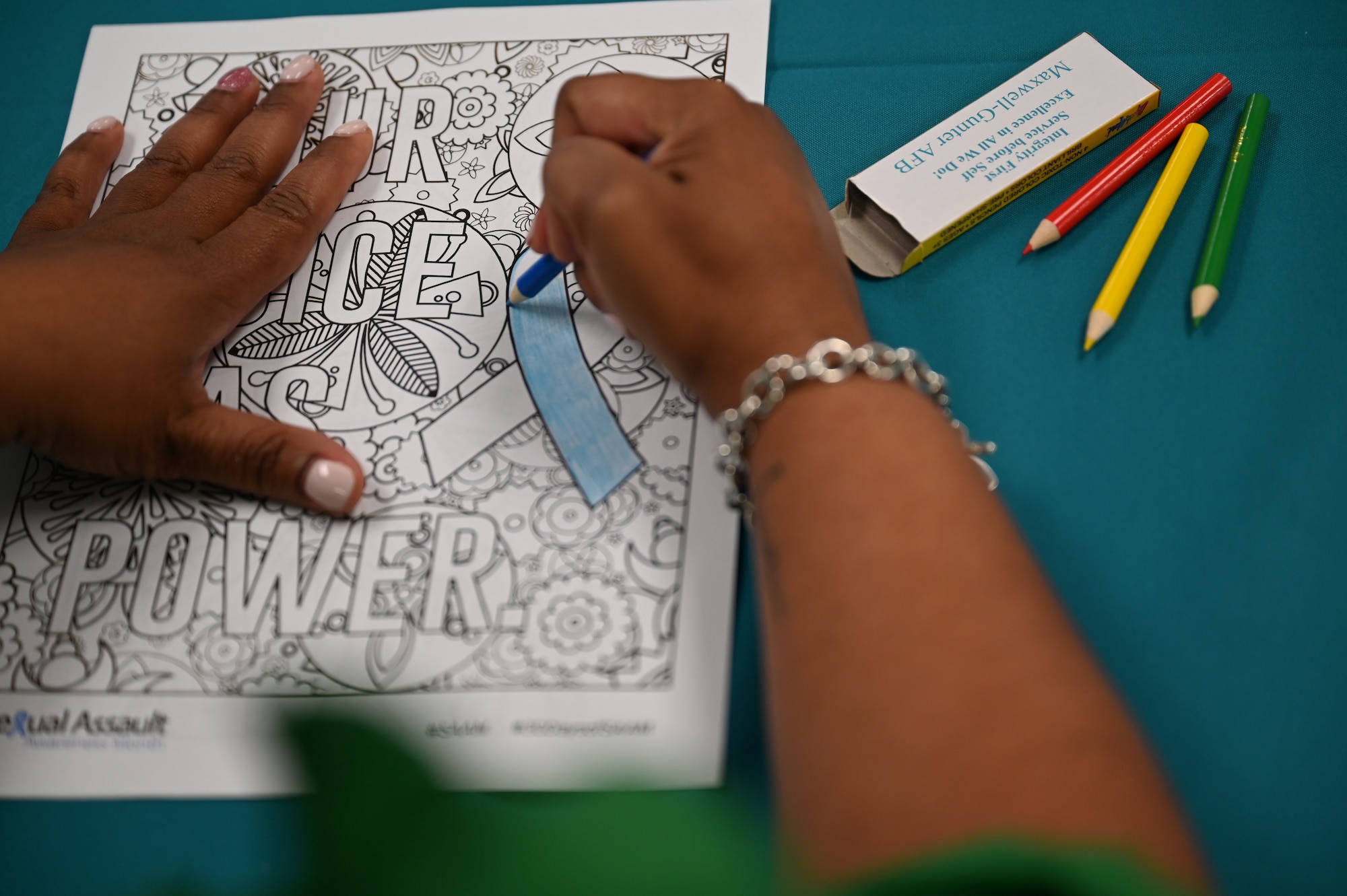 A student works on an adult coloring worksheet at the Integrated Resilience Center on Maxwell Air Force Base, Alabama, May 15, 2026. The IRC provides Airmen, Guardians, civilian employees and families with coordinated support services on mental, physical, social and spiritual well-being.
