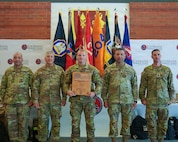 Spc. Christian Welch, assigned to Headquarters and Headquarters Company, 205th Engineer Battalion, 225th Engineer Brigade, Louisiana Army National Guard, poses with senior Louisiana National Guard leaders after being named Region V Soldier of the Year during the Region V Best Warrior Competition awards ceremony at Jackson Barracks in New Orleans, Louisiana, May 7, 2026.