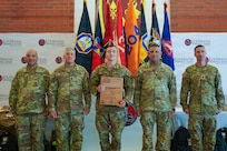 Staff Sgt. Elija Steil, assigned to Bravo Company, 39th Brigade Support Battalion, 39th Infantry Brigade Combat Team, Arkansas Army National Guard, poses with senior Louisiana National Guard leaders after being named Region V Noncommissioned Officer of the Year during the Region V Best Warrior Competition awards ceremony at Jackson Barracks in New Orleans, Louisiana, May 7, 2026.