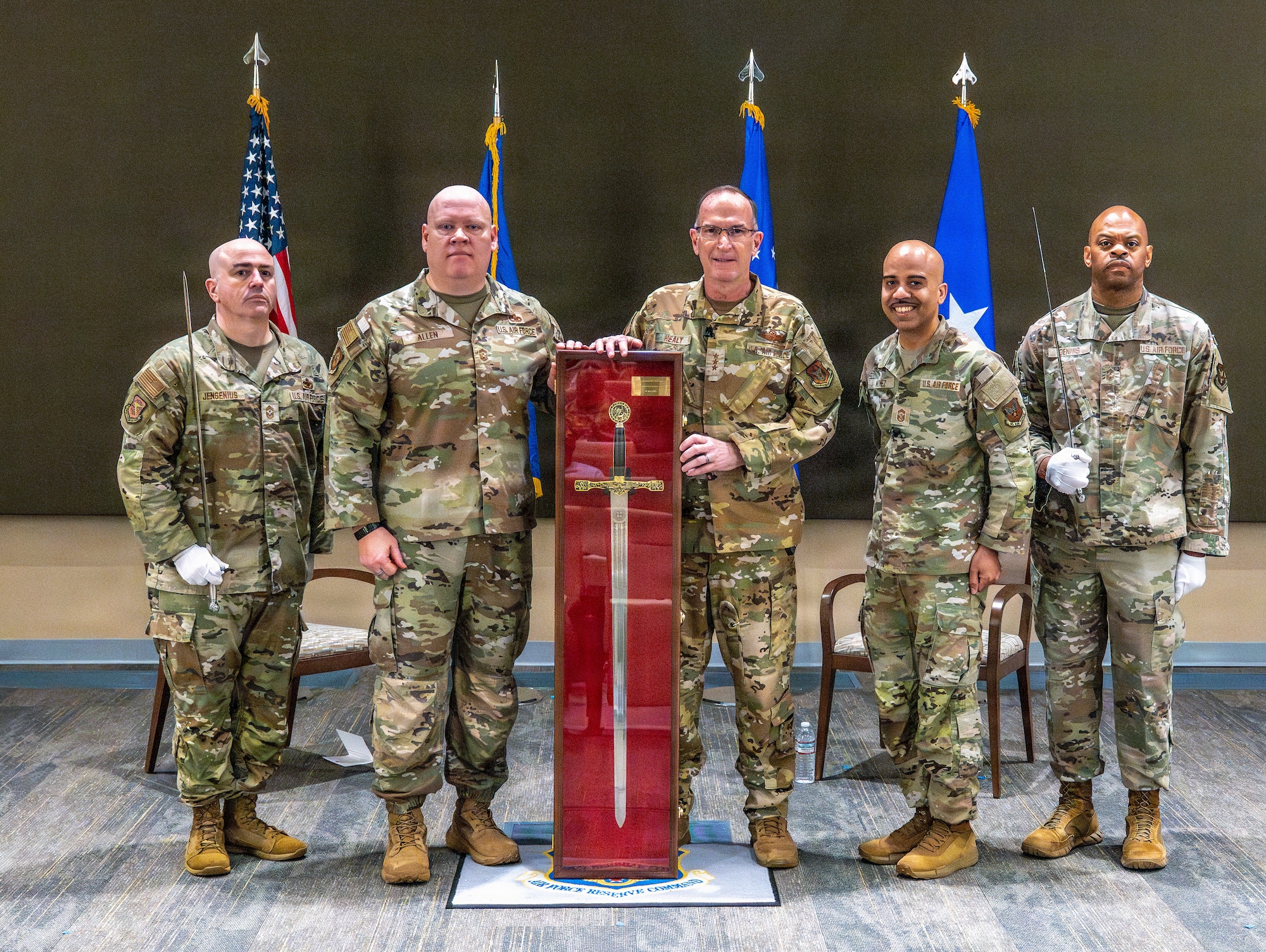 Military member pose with sword