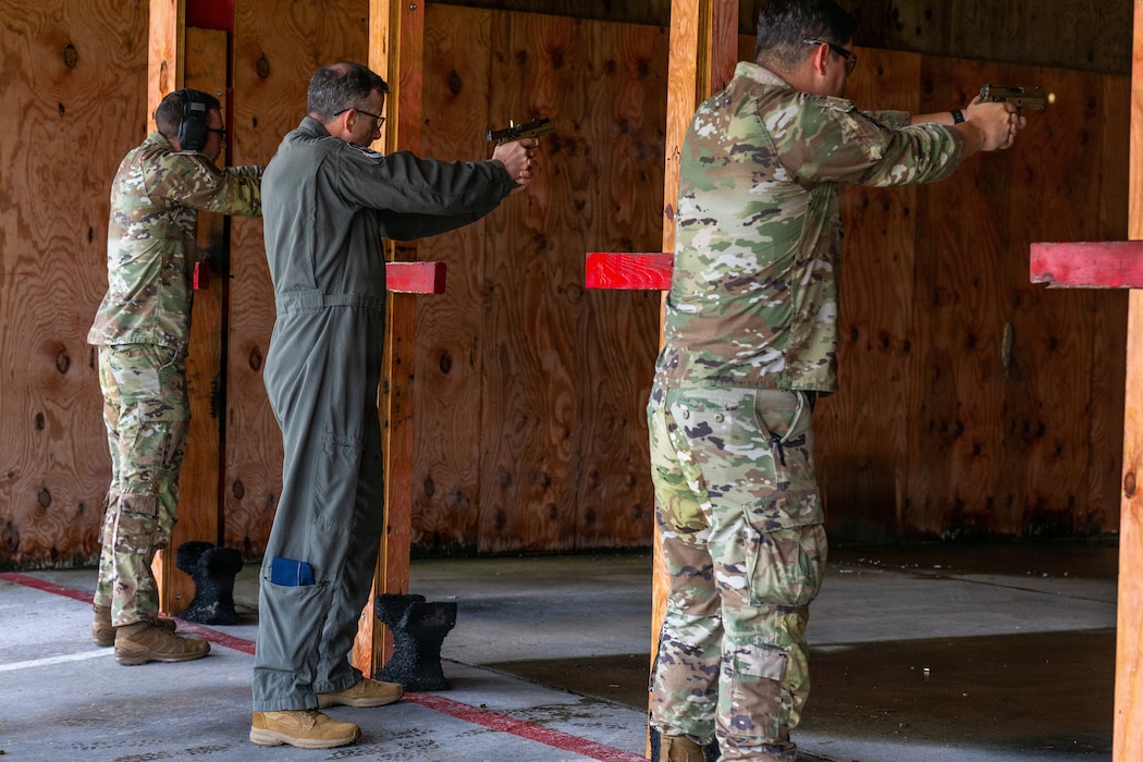 U.S. Air Force Col. Sean Hall, 23d Wing commander, participates in an excellence in competition pistol with other Airmen at Moody Air Force Base, Georgia, May 13, 2026. The event offered Airmen the chance to compete for an excellence in competition pistol badge and strengthen their combat readiness. (U.S. Air Force photo by Airman 1st Class Noah Noonan)