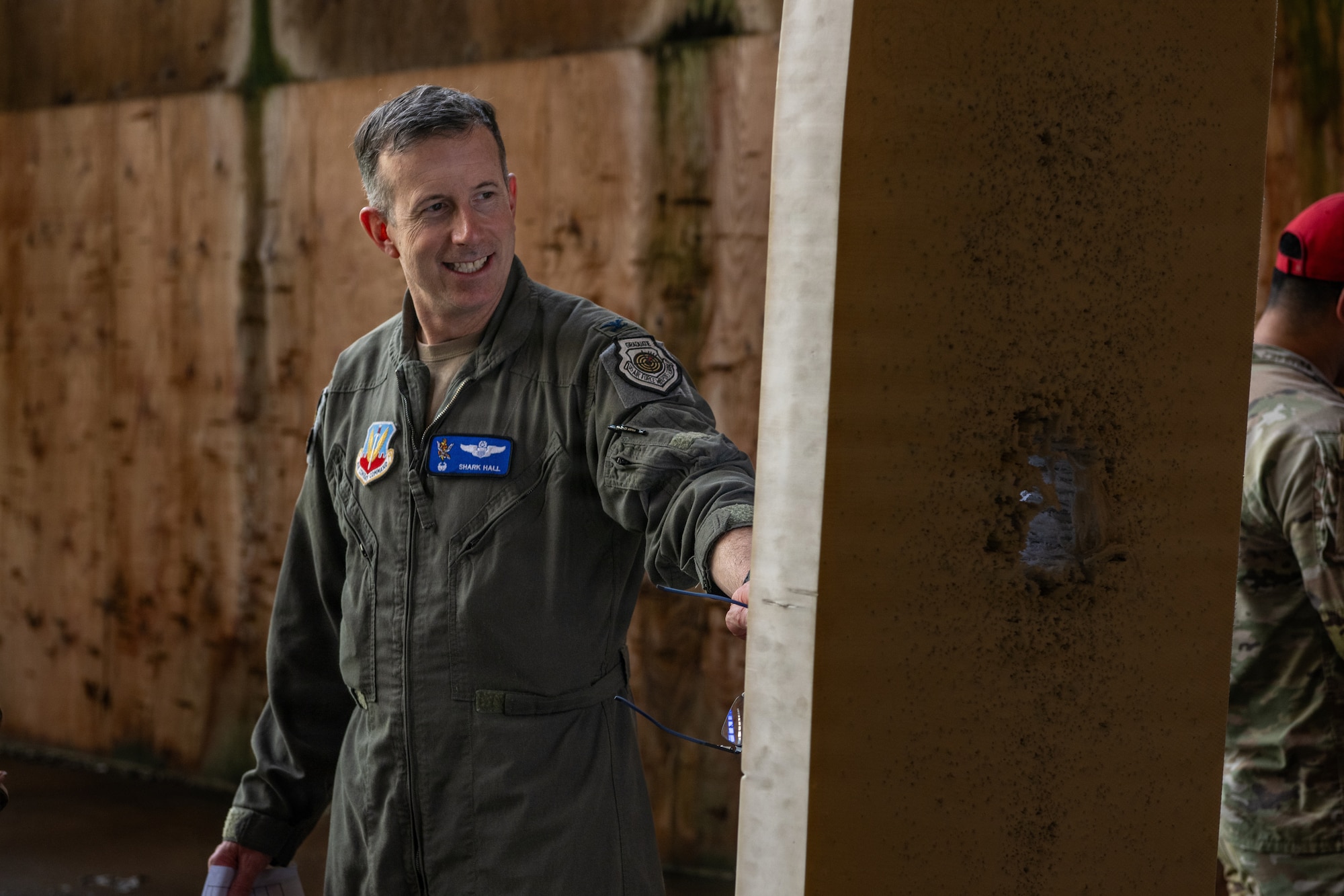 U.S. Air Force Col. Sean Hall, 23d Wing commander, assesses the target after an excellence in competition pistol match at Moody Air Force Base, Georgia, May 13, 2026. The match brought Airmen together to test precision, discipline and marksmanship under competitive conditions. (U.S. Air Force photos by Airman 1st Class Noah Noonan)