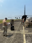 Airmen assigned to the 733d Air Mobility Squadron inspects cargo for airworthiness and safety during Exercise Balikatan 2026 at Cagayan North International Airport, Philippines, April 21, 2026.