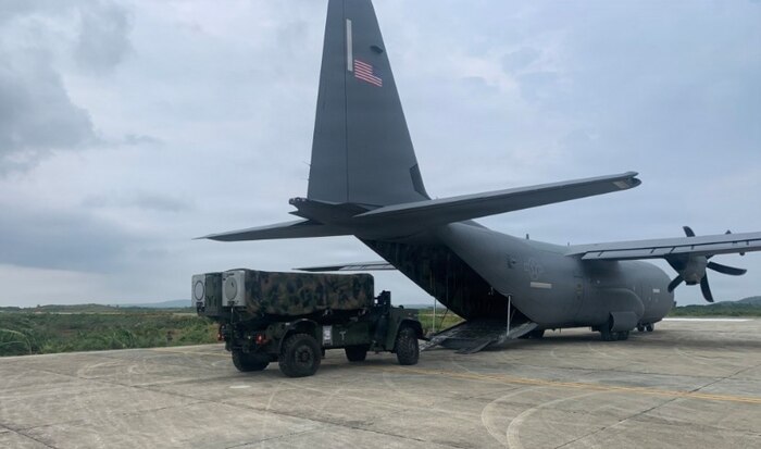 Airmen assigned to the 733d Air Mobility Squadron load cargo onto a C-130J Super Hercules aircraft during Exercise Balikatan 2026 at Cagayan North International Airport, Philippines, April 21, 2026.