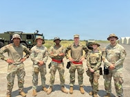 Airmen assigned to the 733d Air Mobility Squadron pose for a photo during Exercise Balikatan 2026, where they supported joint mobility operations across the Indo-Pacific region at Cagayan North International Airport, Philippines, April 21, 2026.