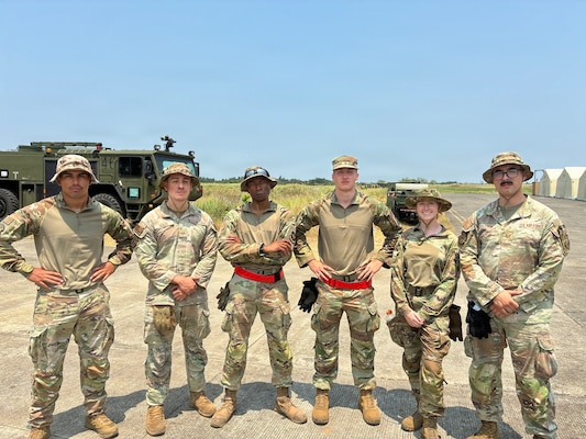 Airmen assigned to the 733d Air Mobility Squadron pose for a photo during Exercise Balikatan 2026, where they supported joint mobility operations across the Indo-Pacific region at Cagayan North International Airport, Philippines, April 21, 2026.