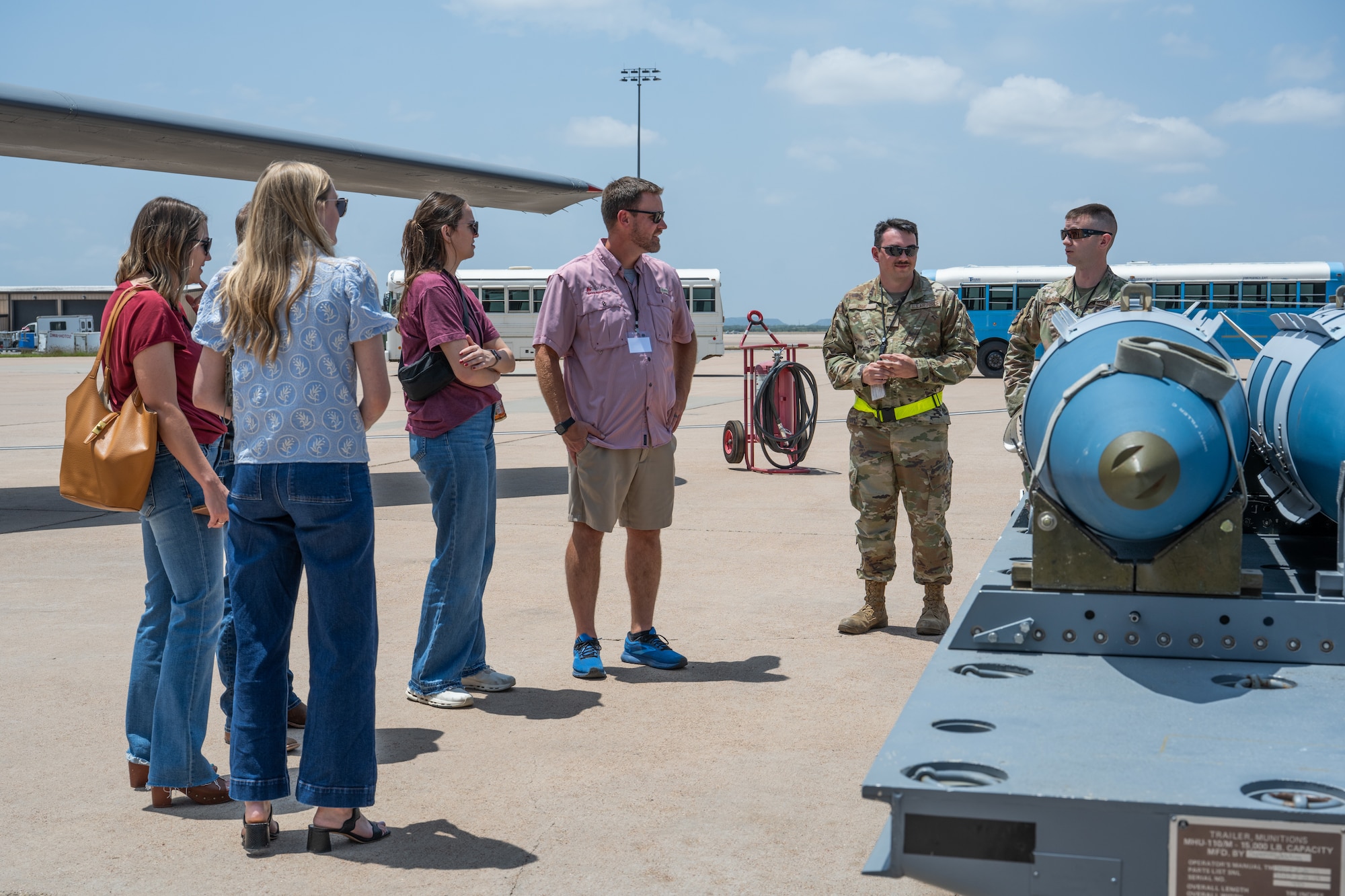 Abilene medical professionals talk with U.S. Airmen assigned to the 7th Munitions Squadron during a medical provider collaboration tour at Dyess Air Force Base, Texas, May 8, 2026. The tour showcased  the B-1B Lancer, C-130J Super Hercules, Joint Direct Attack Munitions and base security technology to give civilian medical providers greater insight into the physical demands of the Lift and Strike mission they support through their medical care. (U.S. Air Force Photo by Airman 1st Class Caleb Schellenberg)