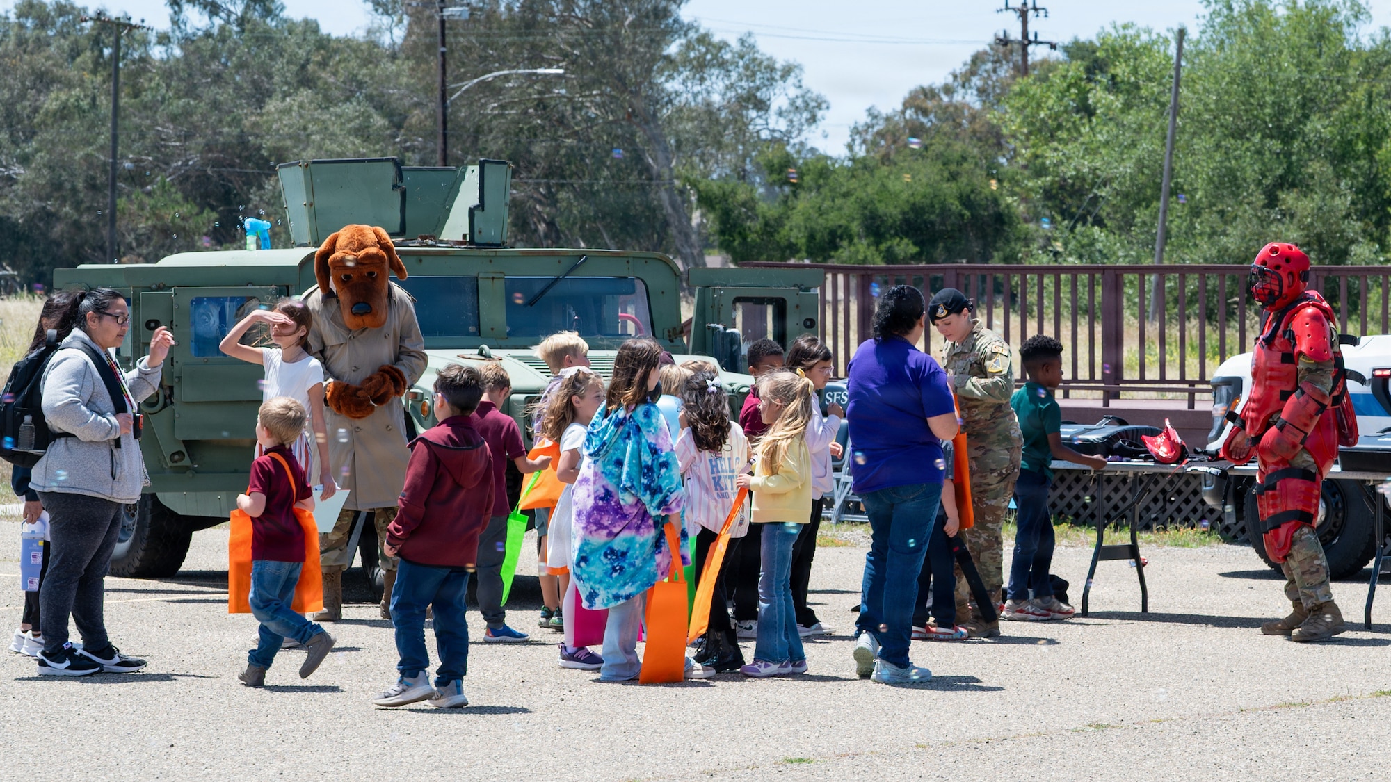 Children gather outside and interact with the festivities