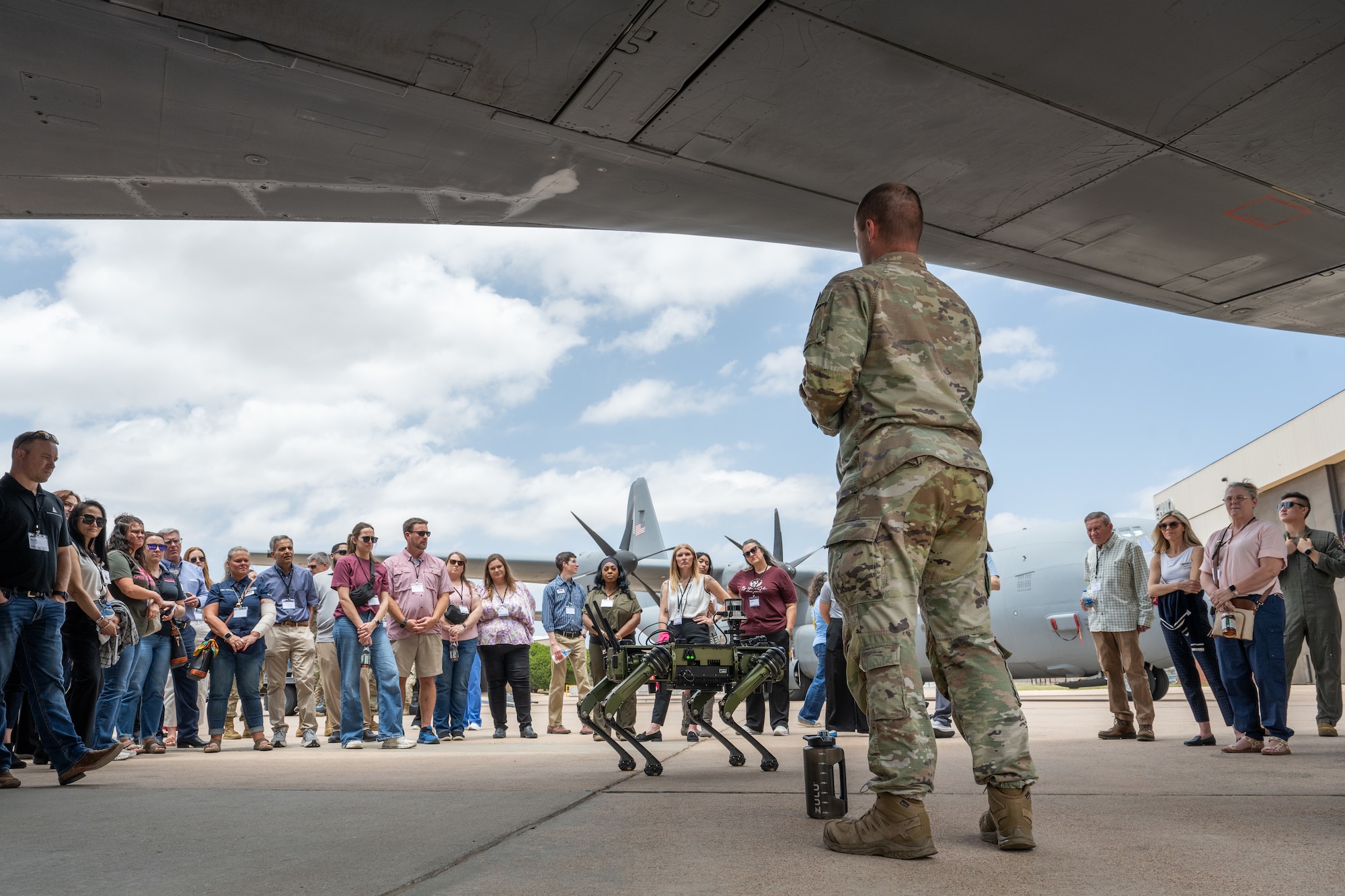 U.S. Air Force Staff Sergeant Tyler Dossett, 7th Security Forces Squadron NCO in charge of counter small unmanned aircraft systems, leads a robotic dog demonstration during a medical provider collaboration tour at Dyess Air Force Base, Texas, May 8, 2026. The demonstration showcased the installation’s modernized force protection capabilities and emerging technologies to local healthcare partners who provide essential medical support to Dyess Airmen. (U.S. Air Force Photo by Airman 1st Class Caleb Schellenberg)
