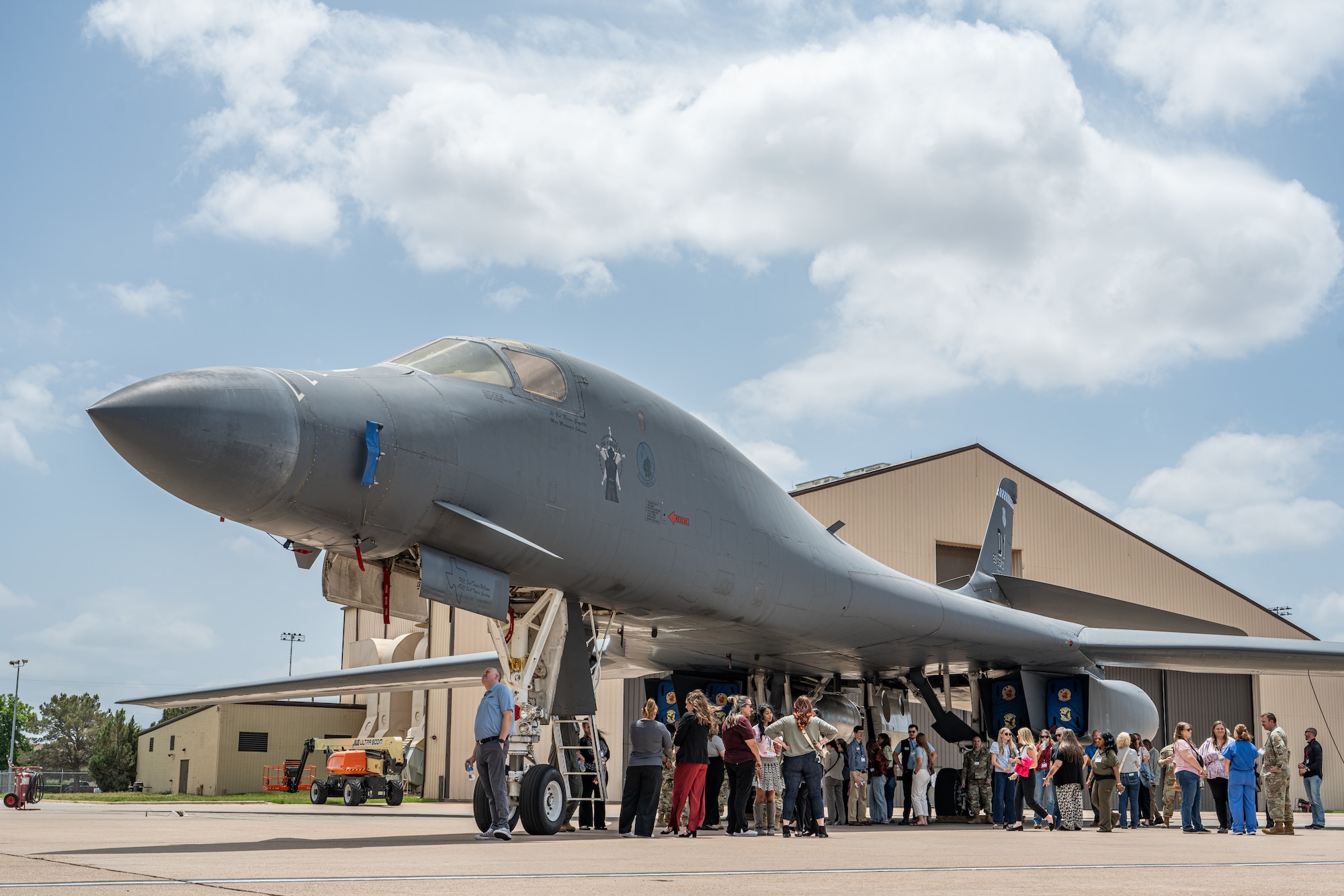 Abilene medical professionals and U.S. Airmen learn about the B-1B Lancer during a medical provider collaboration tour at Dyess Air Force Base, Texas, May 8, 2026. The 7th Medical Group organized the tour to provide local healthcare partners with a deeper understanding of the Lift and Strike mission and the unique occupational environments of the military personnel they treat off-base. (U.S. Air Force Photo by Airman 1st Class Caleb Schellenberg)