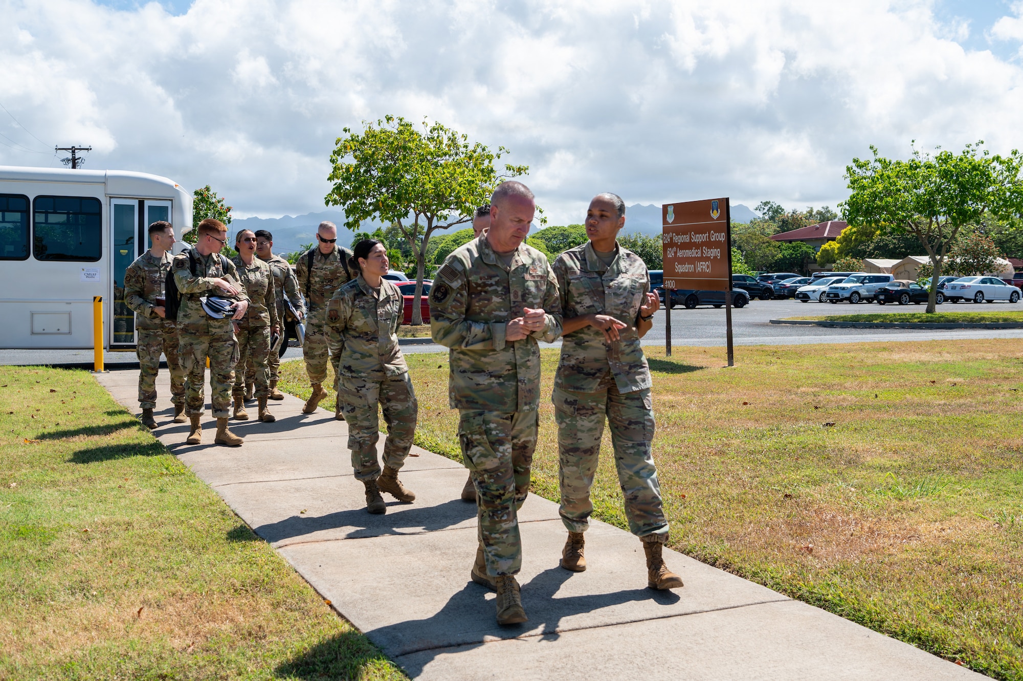 Chief Master Sergeant of the Air Force David Wolfe walks with Col. Mildred Grey-Theriot, 624th Regional Support Group commander.