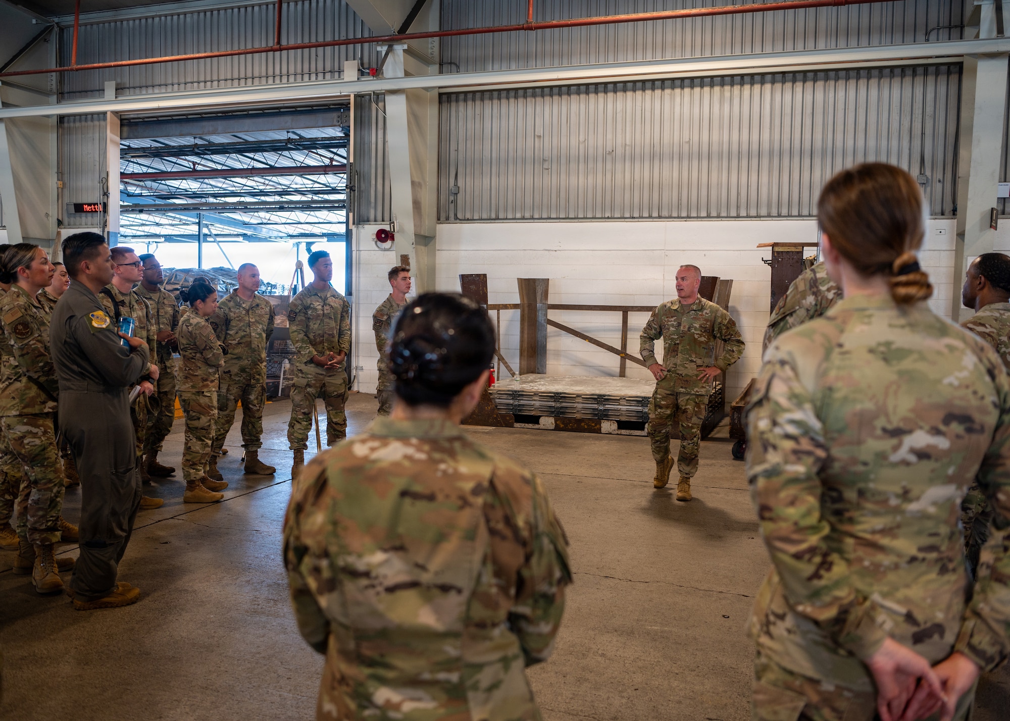 Chief Master Sergeant of the Air Force David Wolfe talks with personnel at the 515th Air Mobility Operations Wing.
