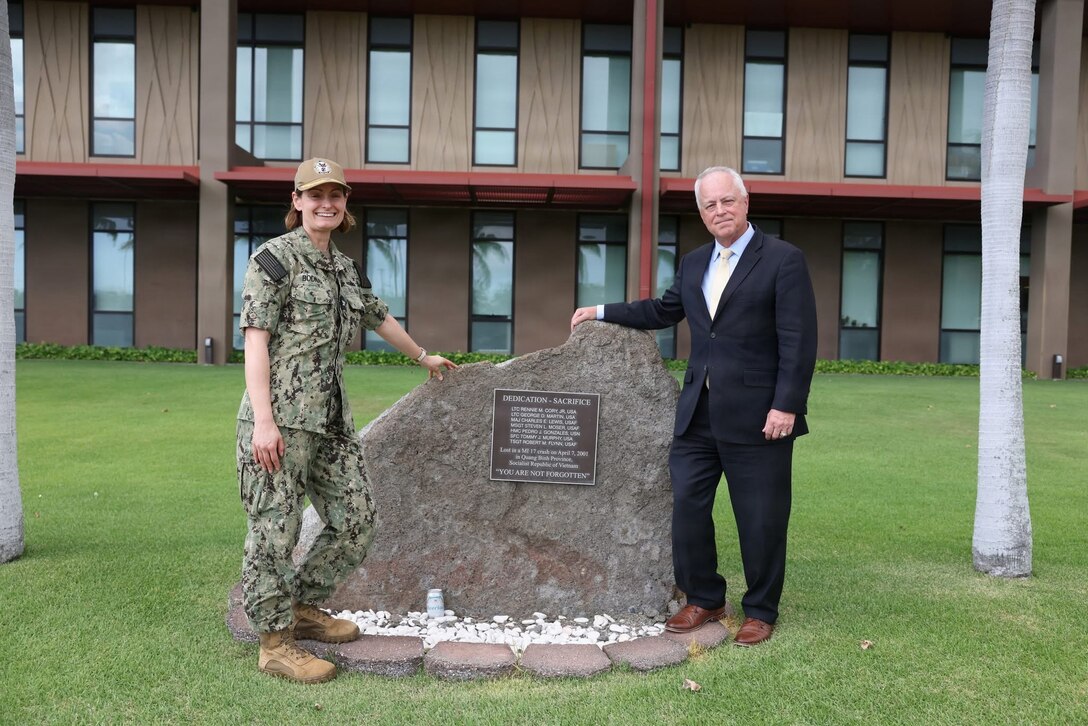 Under Secretary of War for Personnel and Readiness Anthony J. Tata and U.S. Navy Capt. Meghan Bodnar, deputy director for operations for the Defense POW/MIA Accounting Agency, visit the MI 17 Memorial on Heroes’ Green in front of the Daniel K. Inouye DPAA Center for Excellence at Joint Base Pearl Harbor–Hickam, Hawaii, on May 11, 2026.