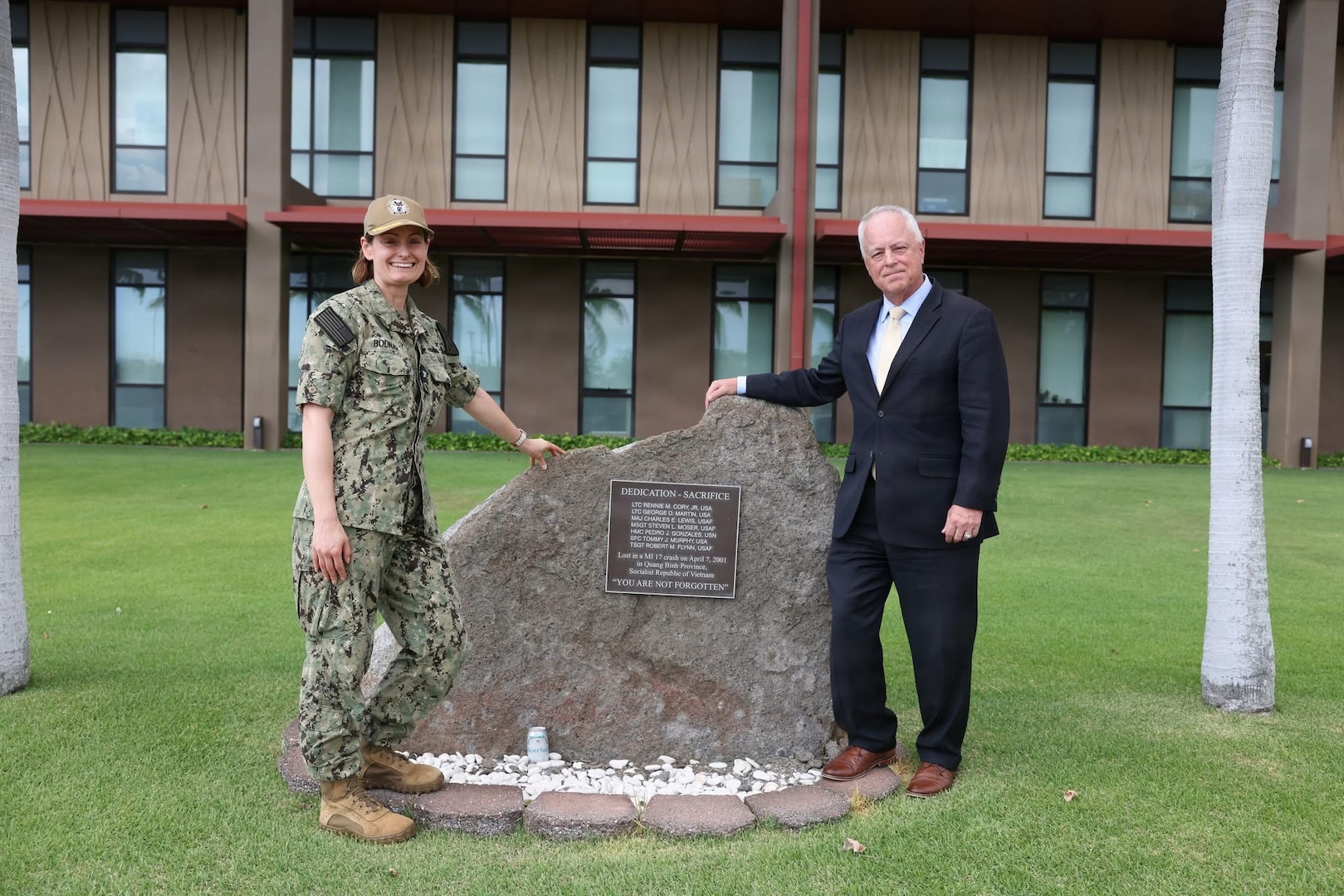 Under Secretary of War for Personnel and Readiness Anthony J. Tata and U.S. Navy Capt. Meghan Bodnar, deputy director for operations for the Defense POW/MIA Accounting Agency, visit the MI 17 Memorial on Heroes’ Green in front of the Daniel K. Inouye DPAA Center for Excellence at Joint Base Pearl Harbor–Hickam, Hawaii, on May 11, 2026.