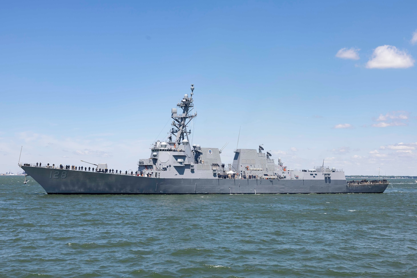 260515-N-EE423-1028 - NORFOLK (May 15, 2026) The newest Arleigh Burke-class guided-missile destroyer, the future USS Ted Stevens (DDG 128) arrives in its future homeport of Naval Station Norfolk , May 15, 2026. The U.S. Navy will commission the future USS Ted Stevens (DDG 128) on a date to be announced at a later time in Whittier, Alaska. (U.S. Navy photo by Mass Communication Specialist 1st Class Sophie A. Pinkham)