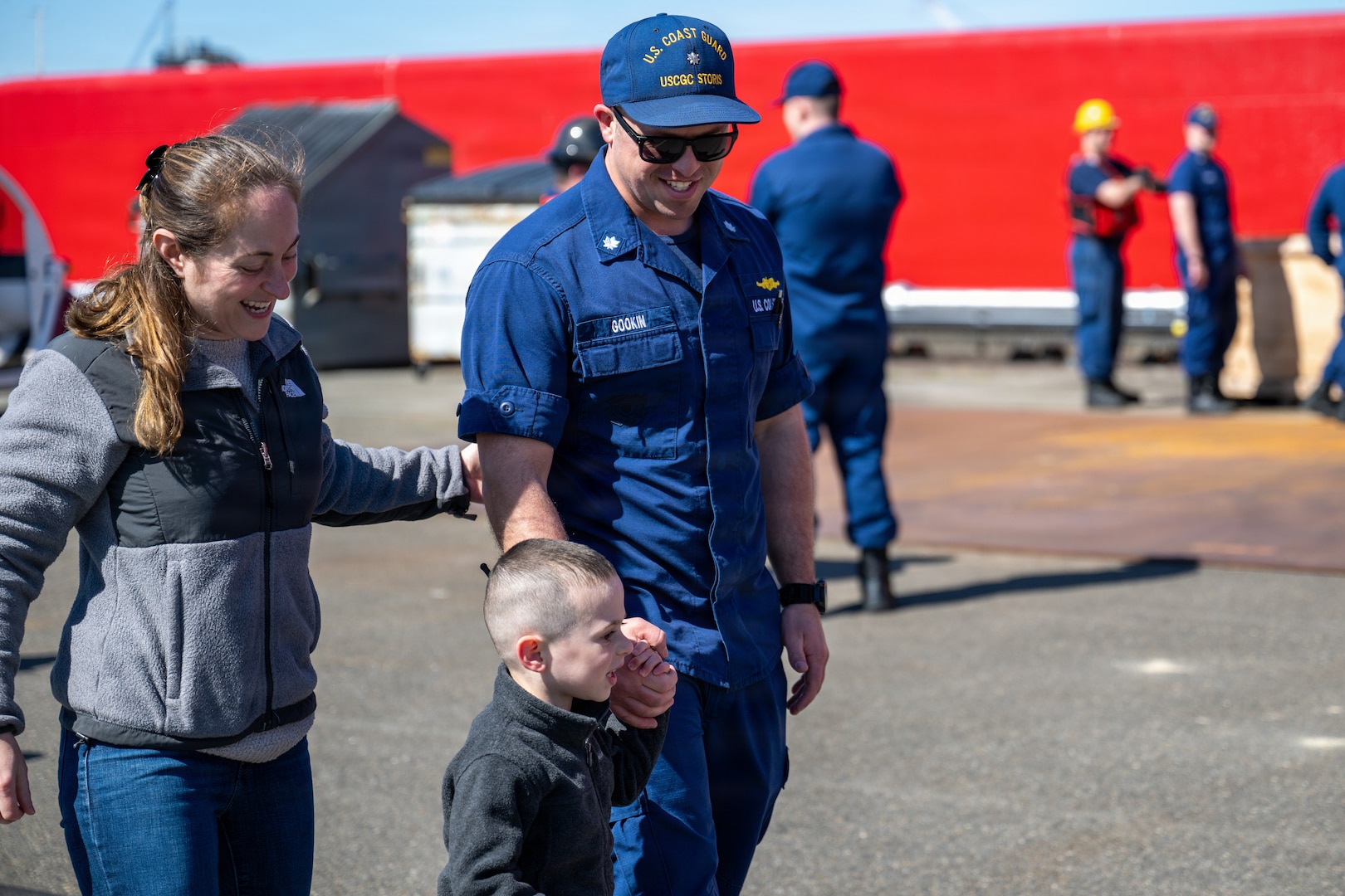 U.S. Coast Guard Cmdr. Curtis Gookin, executive officer, U.S. Coast Guard Cutter Storis (WAGB 21), reunites with his family at Coast Guard Base Seattle following a 36-day patrol to the Bering Sea, May 11, 2026. Storis is a 360-foot medium icebreaker capable of navigating through three feet of ice at five knots, adding crucial capabilities to the Coast Guard's Arctic operations. (U.S. Coast Guard photo by Petty Officer 2nd Class Briana Carter)
