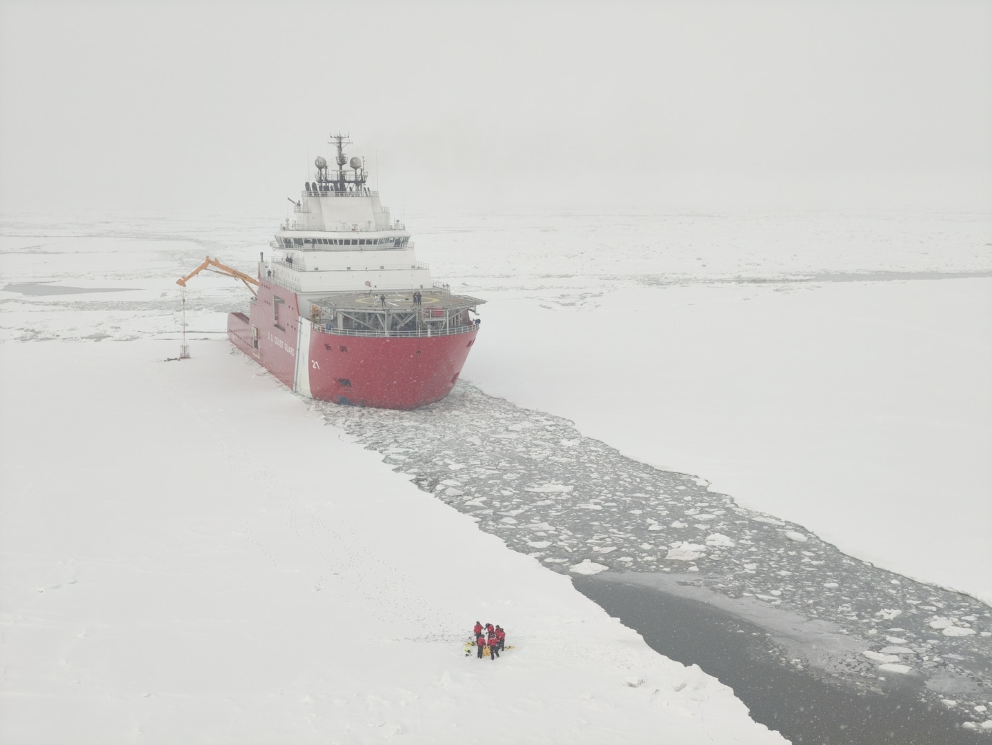 USCGC Storis (WAGB 21) sits hove to in the ice while deploying the cutter’s ice rescue team to conduct training in the Arctic waters of the Bering Sea, April 16, 2026. The crew conducted advanced ice rescue training during the deployment and practiced complex lifesaving maneuvers in unforgiving Arctic conditions to prepare for high-risk search and rescue missions in ice‑covered waters. U.S. Coast Guard courtesy photo.