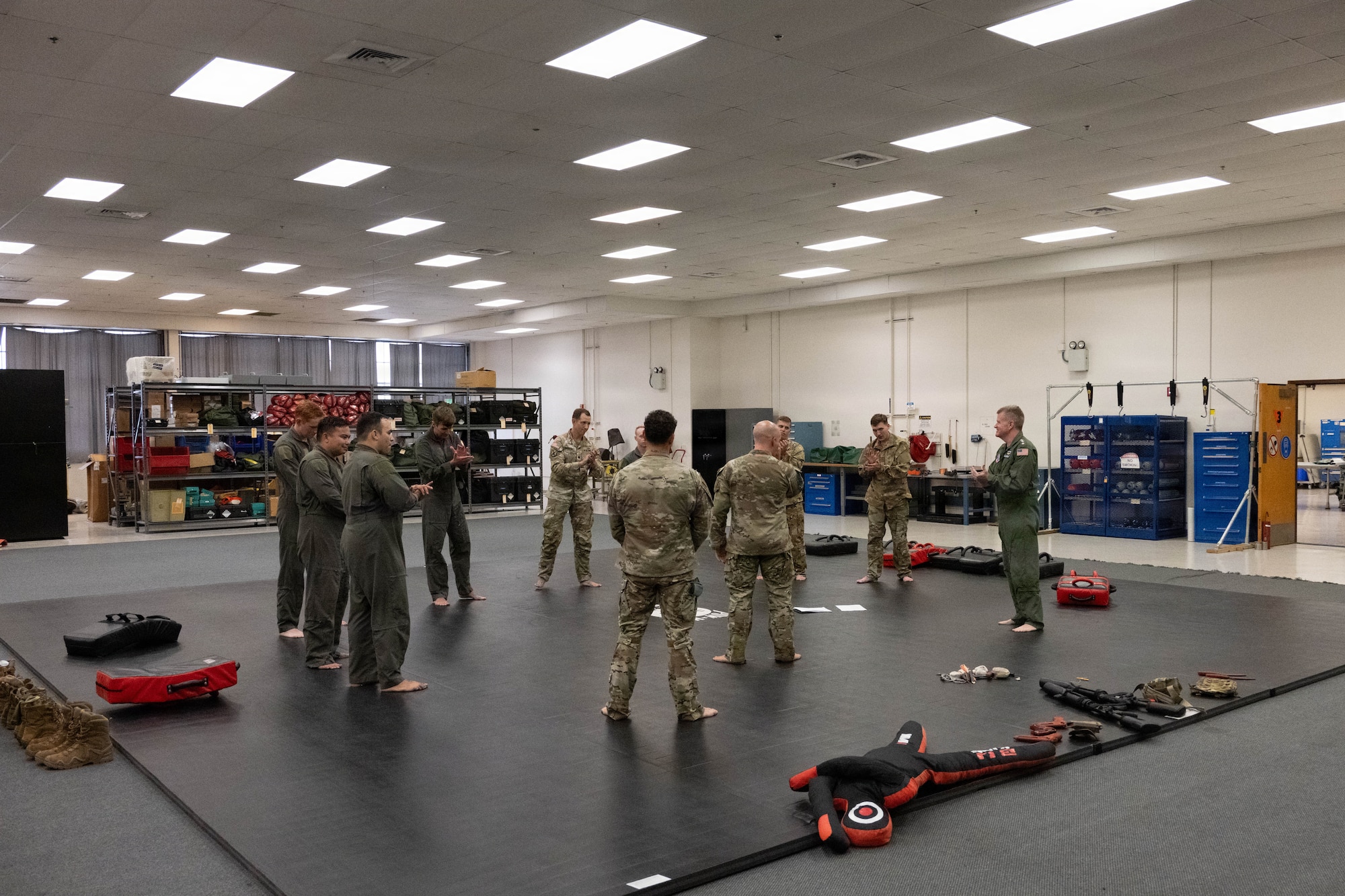 Adm. Samuel J. Paparo, commander of U.S. Indo-Pacific Command, and members of the 15th Wing, wrap up a Survival, Evasion, Resistance and Escape (SERE) course at Joint Base Pearl Harbor-Hickam, May 13, 2026. The SERE course aimed to increase warfighter lethality and readiness while reinforcing efforts to maintain security throughout the Indo-Pacific region. (U.S. Air Force photo by Senior Airman Lauren Torres)