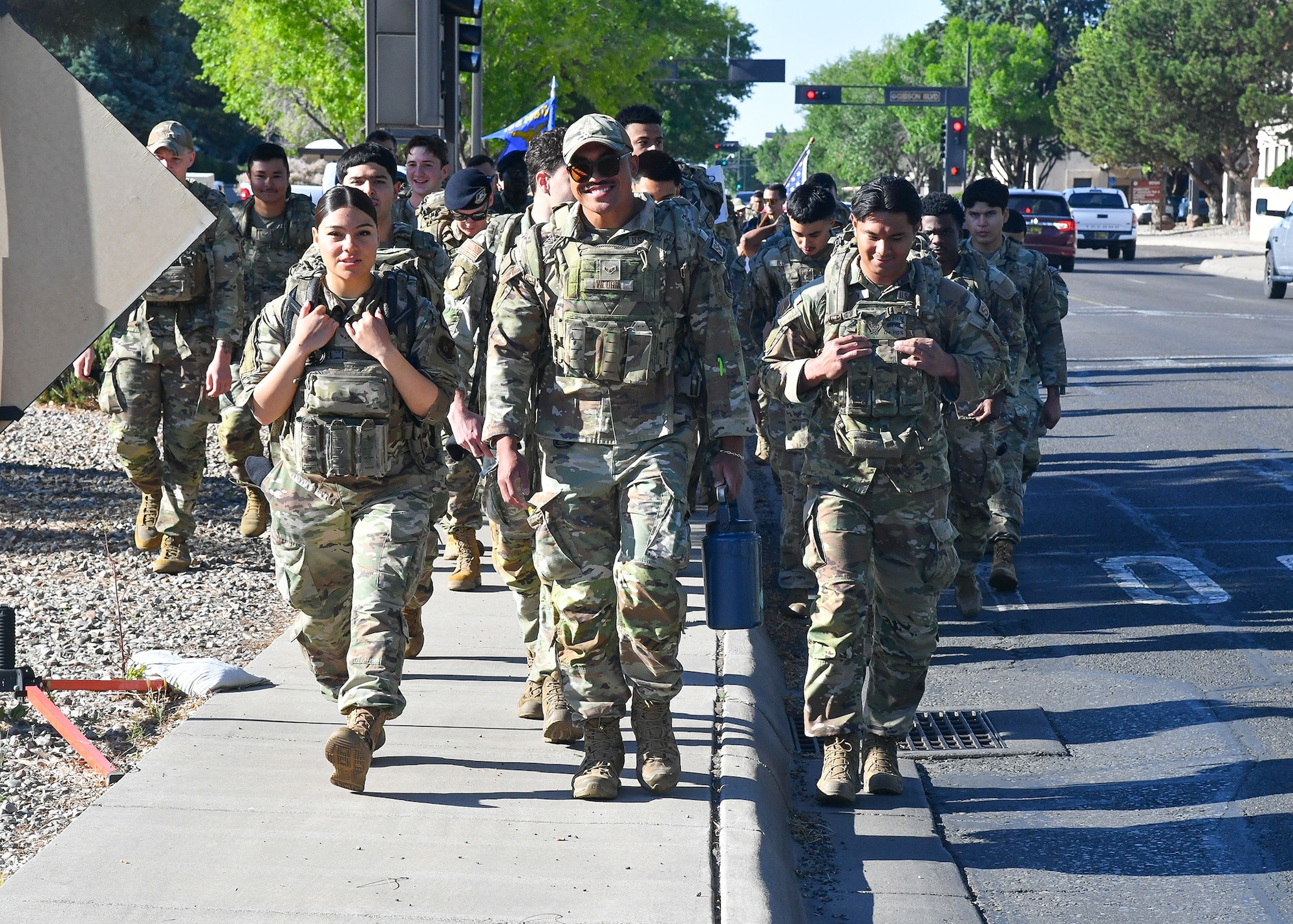 SFG members step off on a ruck march across Kirtland Air Force Base, marking the start of Police Week. The event reflects the strength of Team Kirtland as Airmen, families and law enforcement partners from the Albuquerque Police Department come together to honor Defenders who gave their lives in service. (U.S. Air Force photo by Todd Berenger)