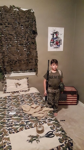 U.S. Army Spc. Nicolas Ferrari poses in military-themed attire as a child in Groveland, Florida, in 2015. Years later, Ferrari fulfilled his childhood dream of military service and deployed to East Africa in support of operations in the Horn of Africa. (U.S. Air Force photo by Michelle Ferrari)