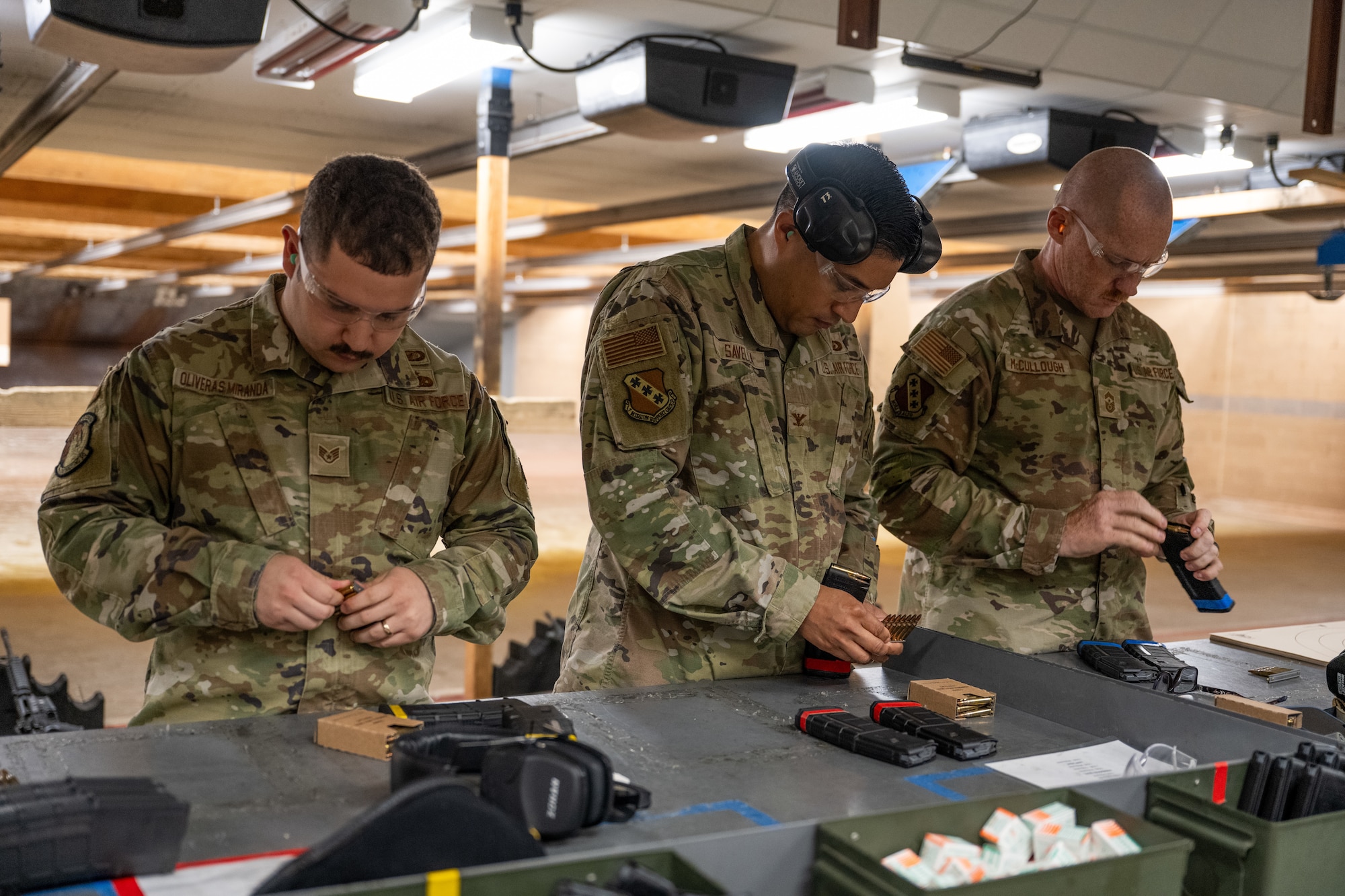U.S. Airmen load magazines prior to a shooting competition during National Police Week at Dyess Air Force Base, Texas, May 11, 2026. National Police Week occurs annually during the week of May 15 to coincide with Peace Officers Memorial Day. (U.S. Air Force photo by Airman 1st Class Caleb Schellenberg)