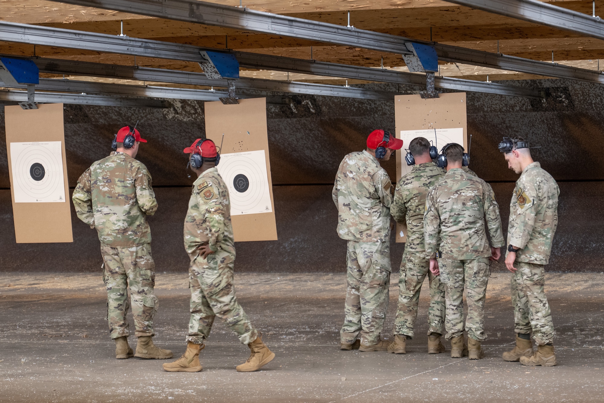 U.S. Air Force Combat Arms Training and Maintenance instructors assigned to the 7th Security Forces Squadron score targets during a shooting competition during National Police Week at Dyess Air Force Base, Texas, May 11, 2026. The observance was established after former President John F. Kennedy signed a proclamation in 1962 designating May 15 as Peace Officers Memorial Day and the surrounding week as National Police Week. (U.S. Air Force photo by Airman 1st Class Caleb Schellenberg)