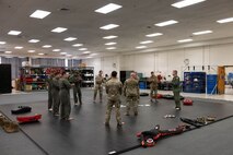 Adm. Samuel J. Paparo, commander of U.S. Indo-Pacific Command, and members of the 15th Wing, wrap up a Survival, Evasion, Resistance and Escape (SERE) course at Joint Base Pearl Harbor-Hickam, May 13, 2026. The SERE course aimed to increase warfighter lethality and readiness while reinforcing efforts to maintain security throughout the Indo-Pacific region. (U.S. Air Force photo by Senior Airman Lauren Torres)