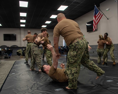 SUFFOLK, Va. (April 22, 2026) Expeditionary Medicine (ExMed) Sailors practice personal defense techniques in Suffolk, Va., April 22, 2026. The week-long training exercise brought Naval Medical Forces Atlantic (NMFL) and Naval Medical Forces Pacific (NMFP) Expeditionary Medicine (ExMed) Sailors together for standardized combat skills training. (U.S. Navy photo by Mass Communication Specialist 2nd Class Thomas Boatright)