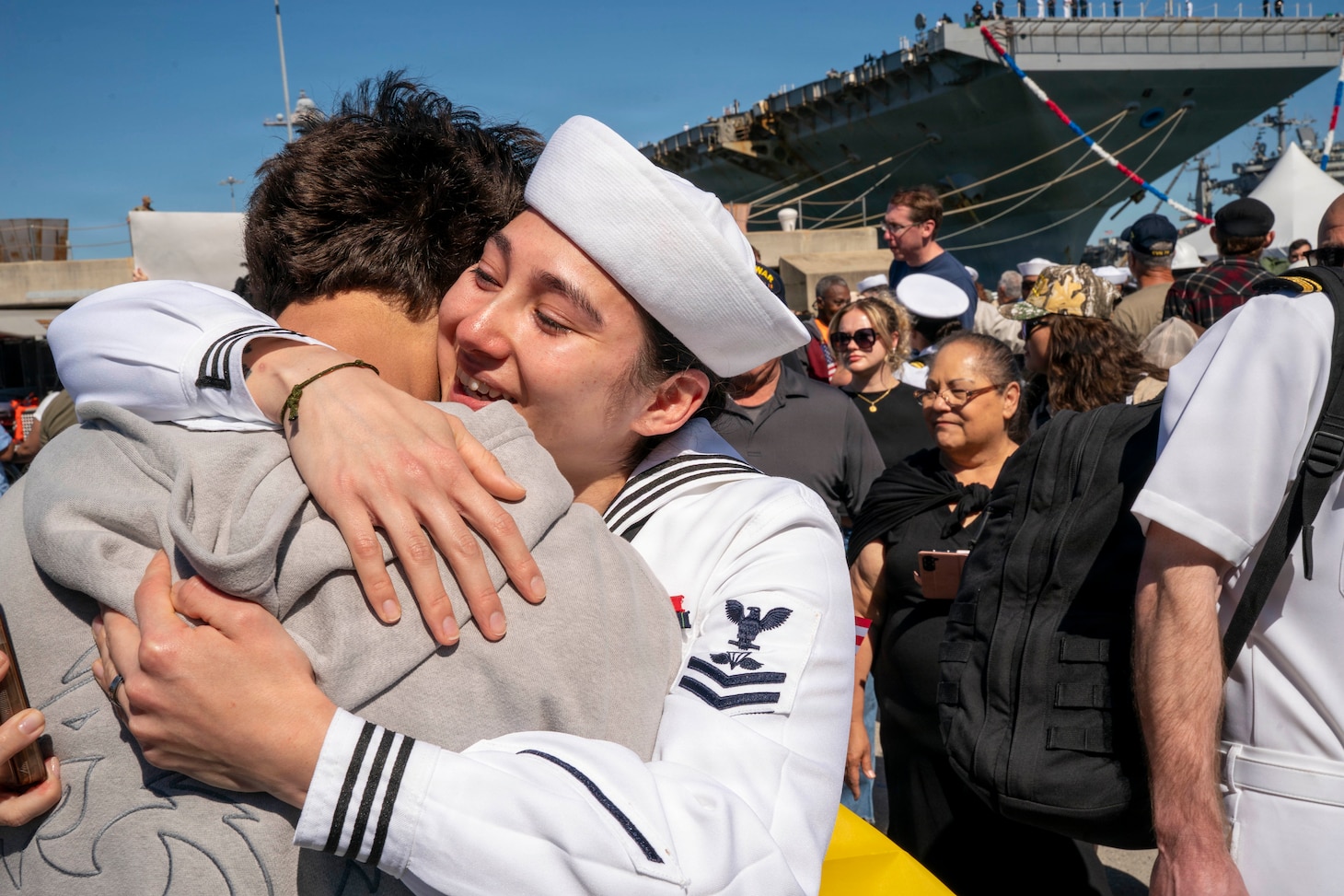 NORFOLK, Va. (May 16, 2026) – Aircrew Survival Equipmentman 2nd Class Ireland Lowe, assigned to the world's largest aircraft carrier, USS Gerald R. Ford (CVN 78), hugs her family on the pier at Naval Station Norfolk, May 16, 2026, following a historic 11-month deployment to U.S. 2nd, 4th, 5th, and 6th Fleets as part of the Gerald R. Ford Carrier Strike Group. Before returning to Norfolk after 326 days, the Gerald R. Ford crew conducted 23 replenishments-at-sea and sailed over 57,713 nautical miles. Embarked Carrier Air Wing 8 logged more than 5,760 flight hours and 12,200 flight launches. (U.S. Navy photo by Mass Communication Specialist 1st Class Clay M. Whaley)